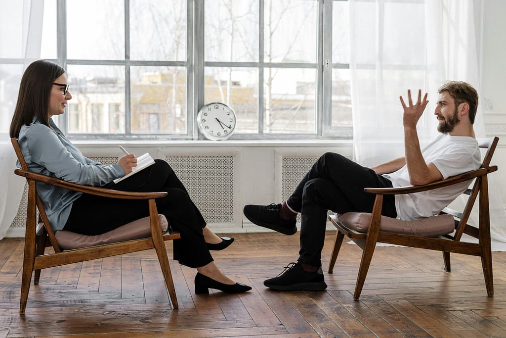 Photo of two people having a conversation