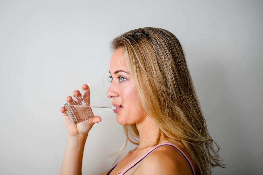 Image of girl drinking water. intermittent fasting