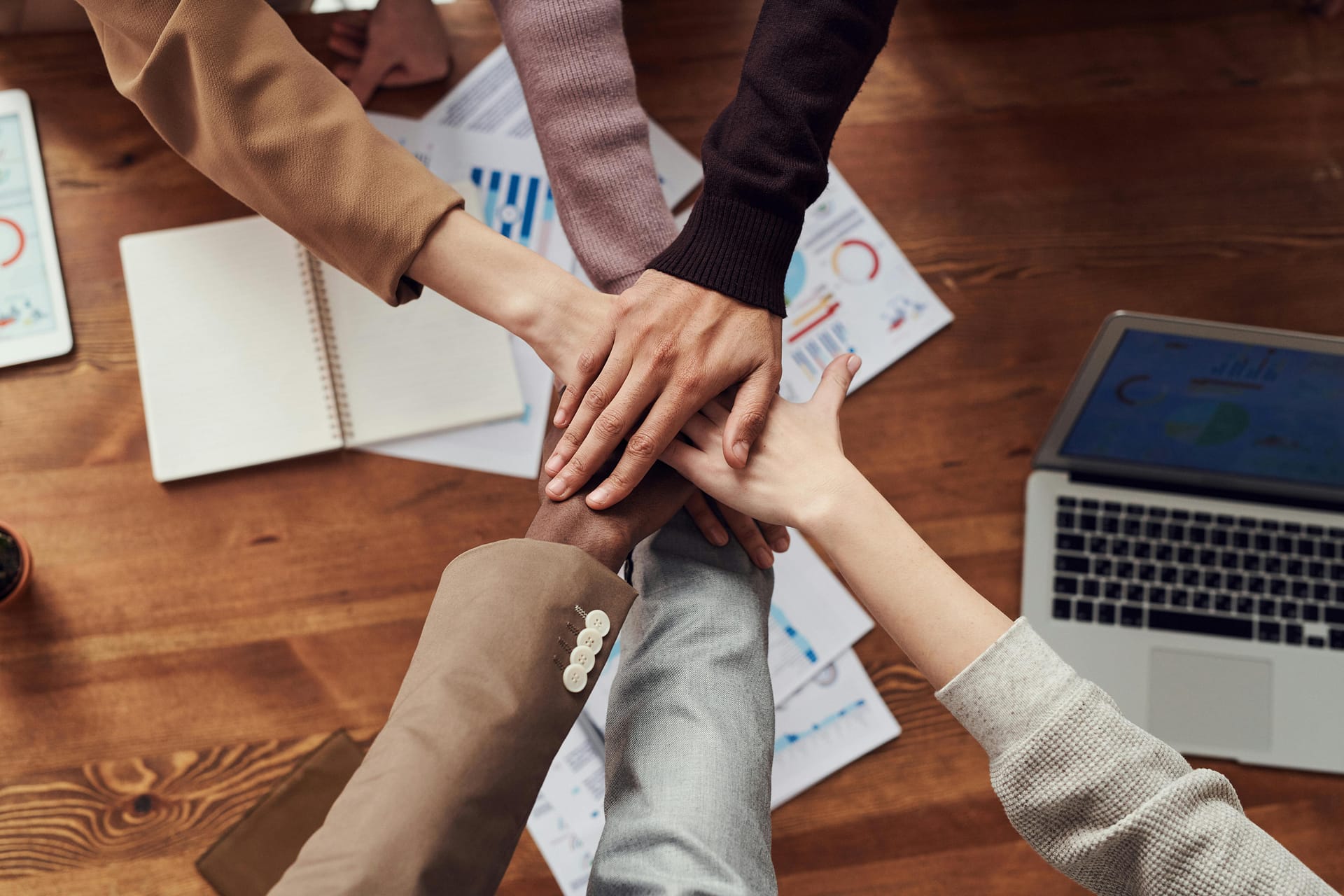 image of hands on top of each other promoting a team