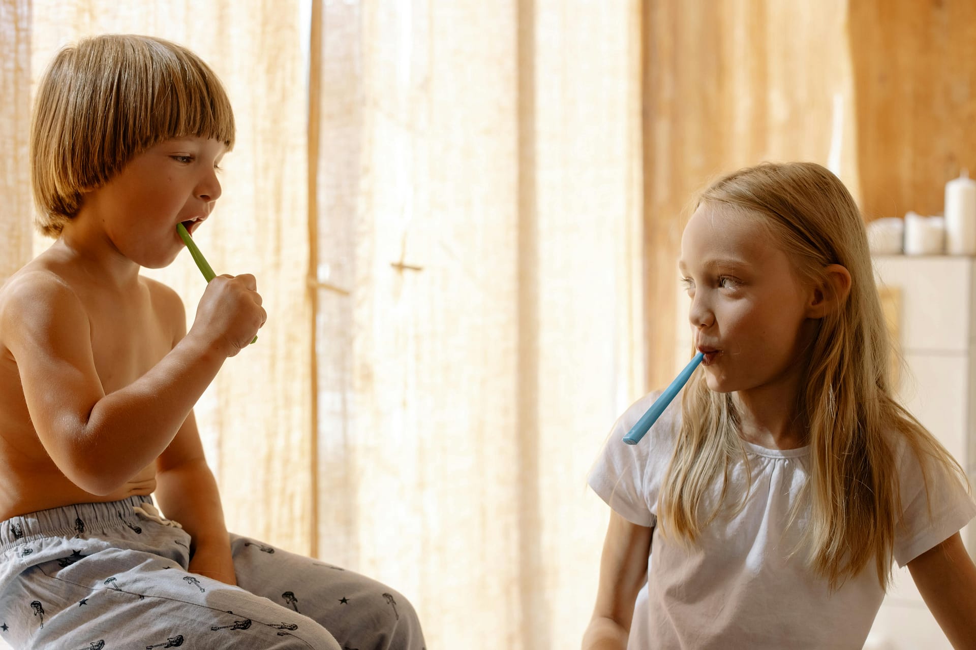 Image of children brushing teeth. The perils of fluoride
